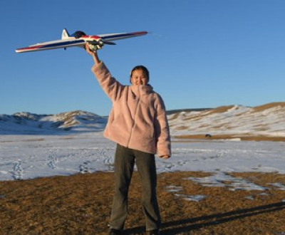 A girl with a flight toy