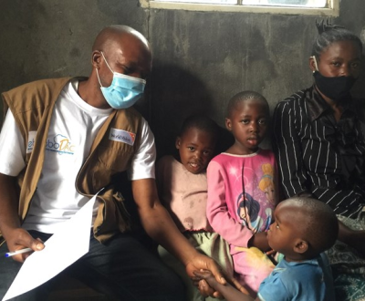 Community Health worker visiting a family in the DRC