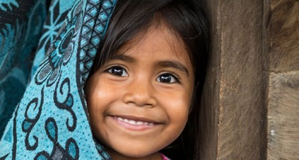 Little girl smiling towards the camera