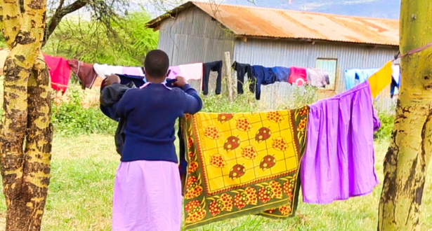 Esther from Kenya doing her routine cleaning at the dormitories