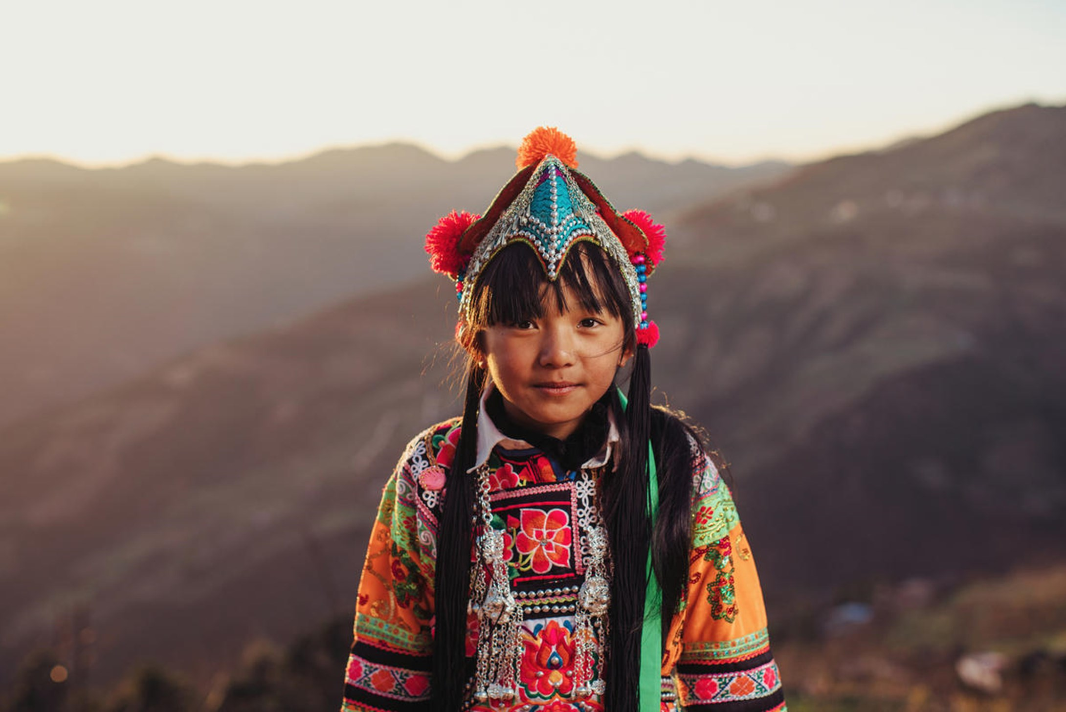 Chengzhen, a third grader from China, is dressed in traditional costumey