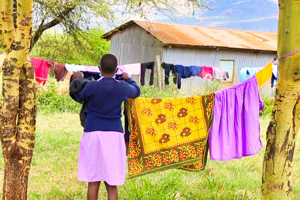 Esther from Kenya doing her routine cleaning at the dormitories