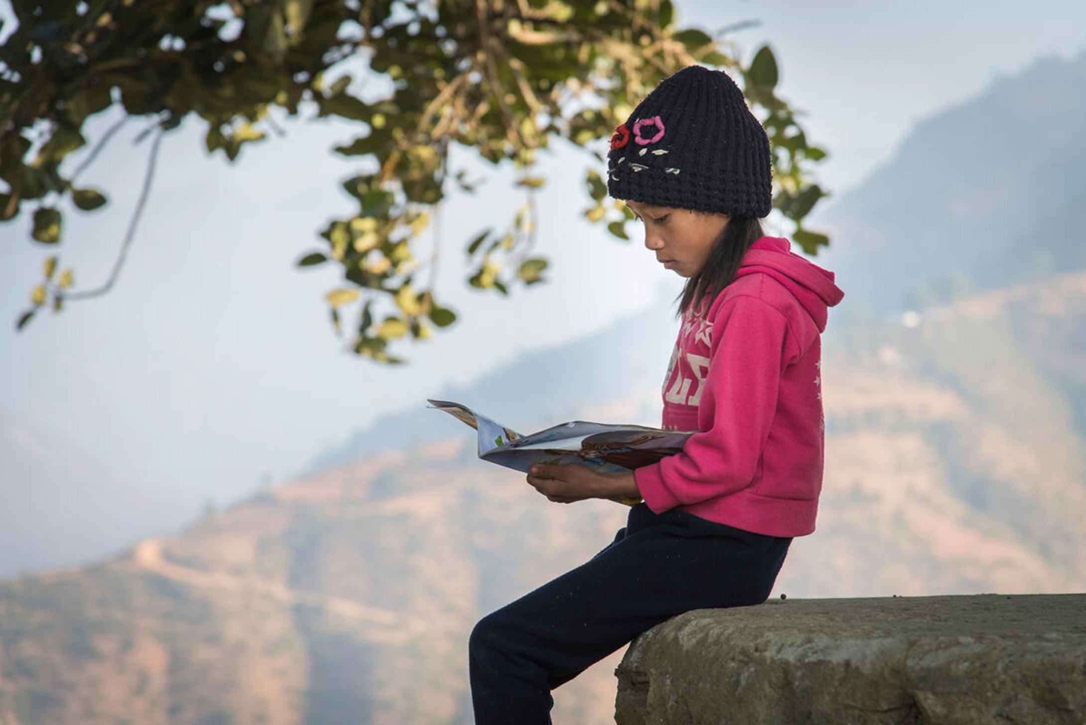 A child who is part of the Reading Club in Nepal