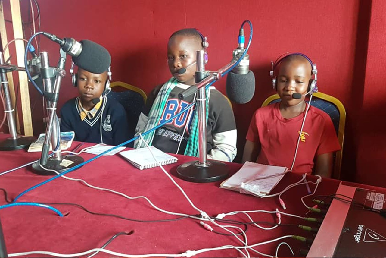 Members of the Busia Children's Parliament at local station Jogo FM speaking about children's issues amidst the COVID-19 pandemic in Busia.