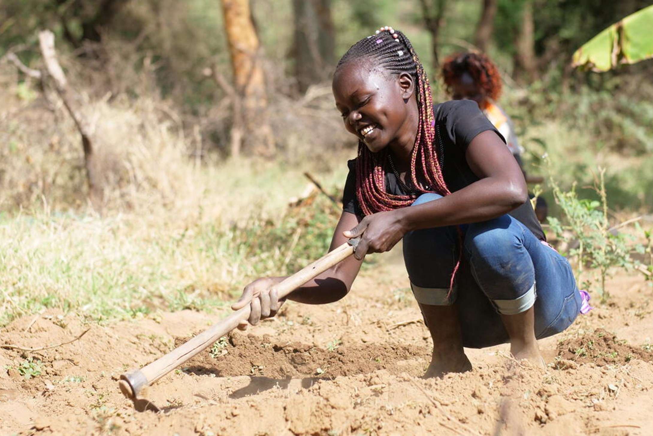 Ruth in the farm field in Kenya doing FMNR