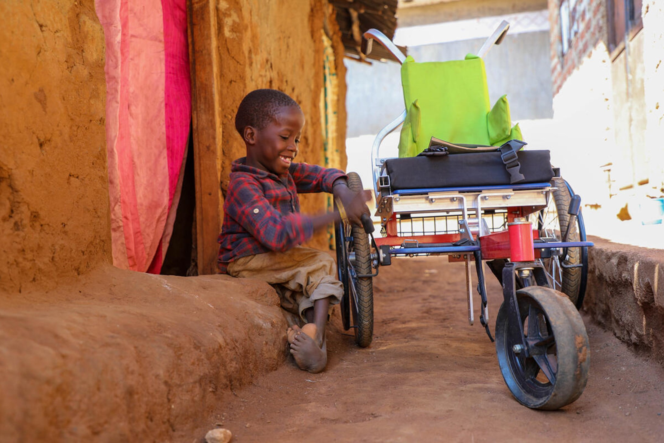 Isma, from Uganda, born with a disability received a wheelchair from World Vision